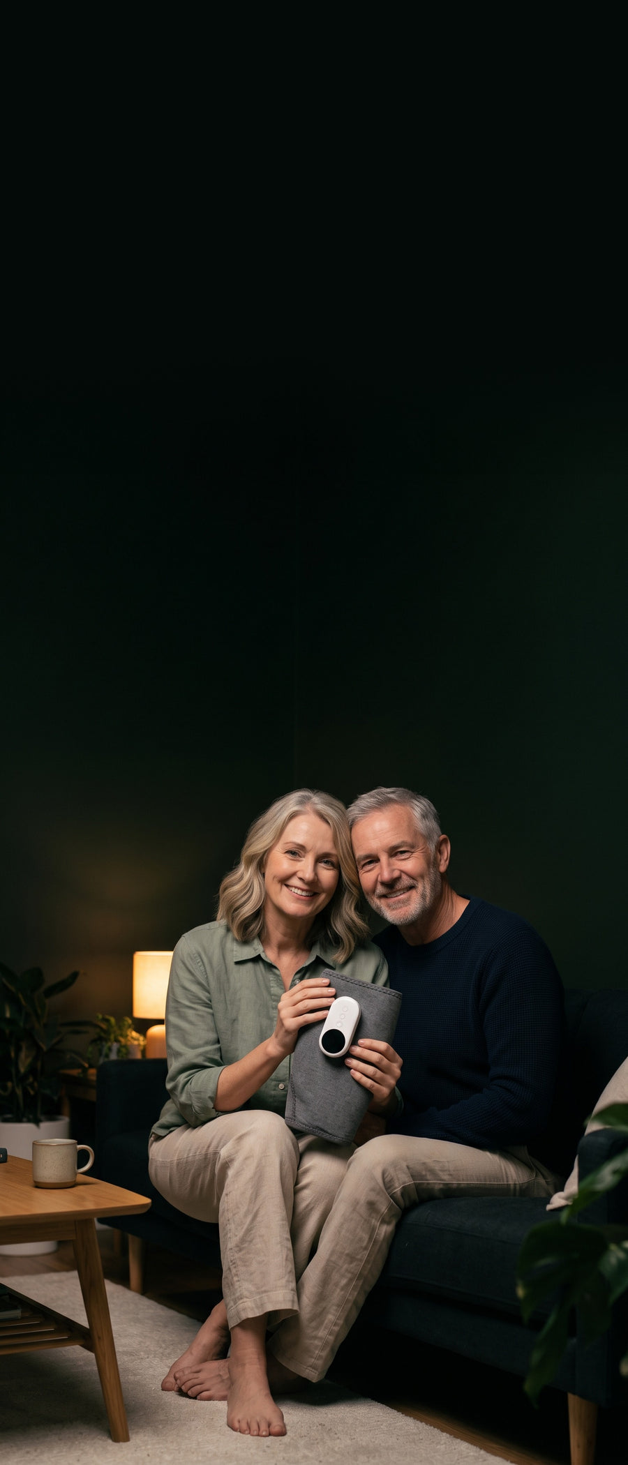 Couple at home holding the Amblewell CalfWave (mobile)